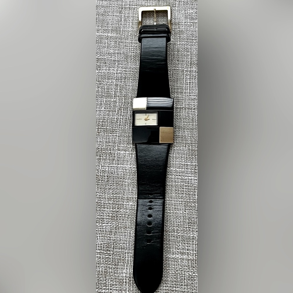 DKNY watch. Black and gold colour block. Dress up or down.
